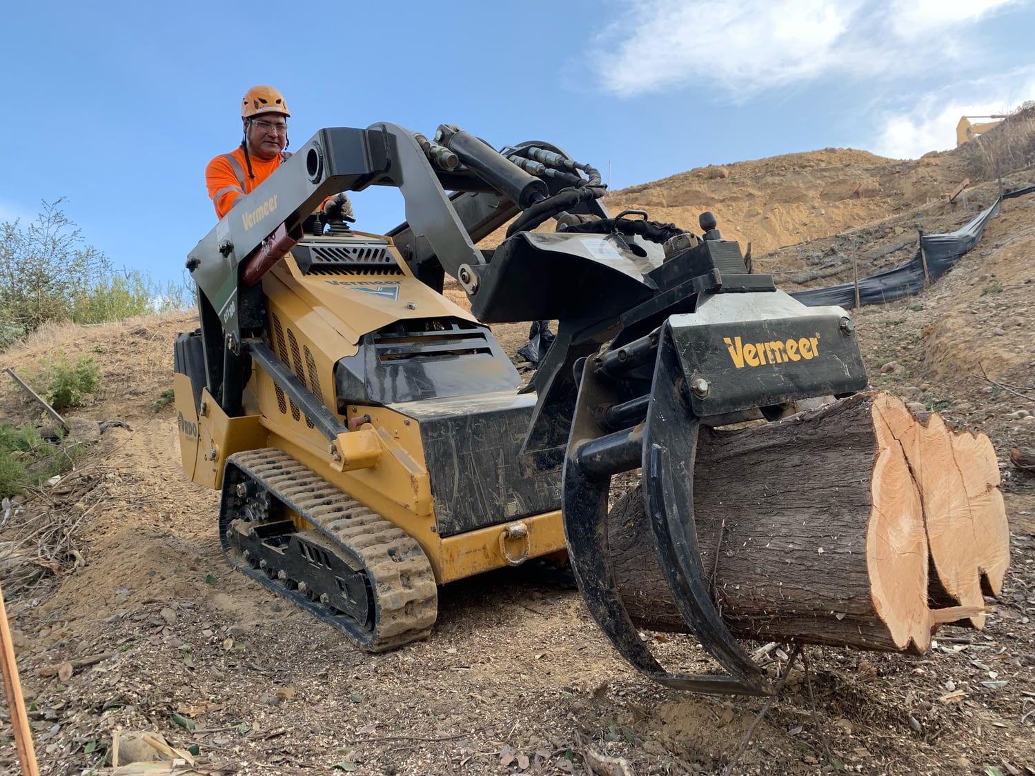 Laborer on a Skid Steer Machine